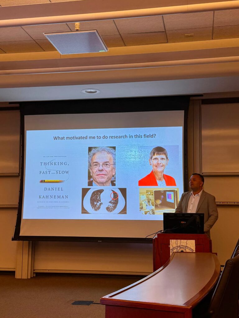 Ulas Bagci delivers a keynote at MIPS XXI 2026 — original accompanying photograph